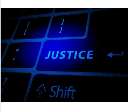 Clavier numérique dont la touche entrée porte l'indication "justice"